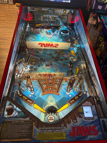 Image of Stern Pinball LOADED Jaws 50th Anniversary Pinball Machine with Stern Topper